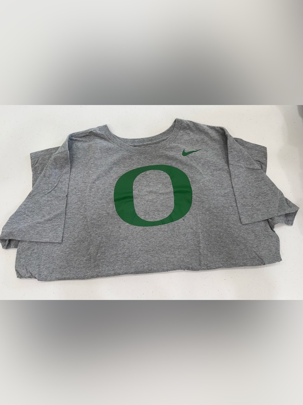 Nike Kids Gray T-Shirt with Green 'O' Logo
